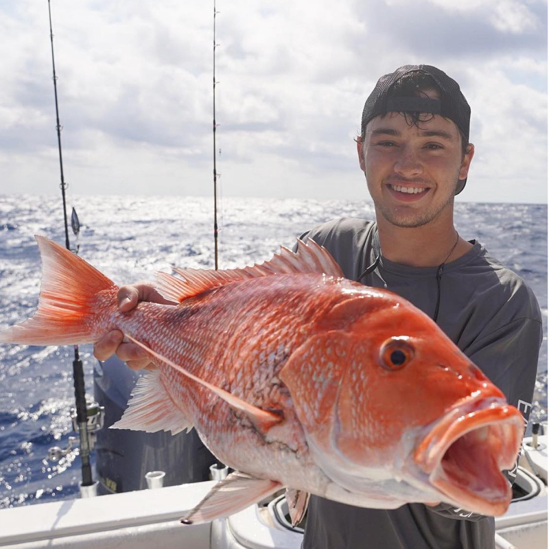 Colby Blackwell holding a red snapper