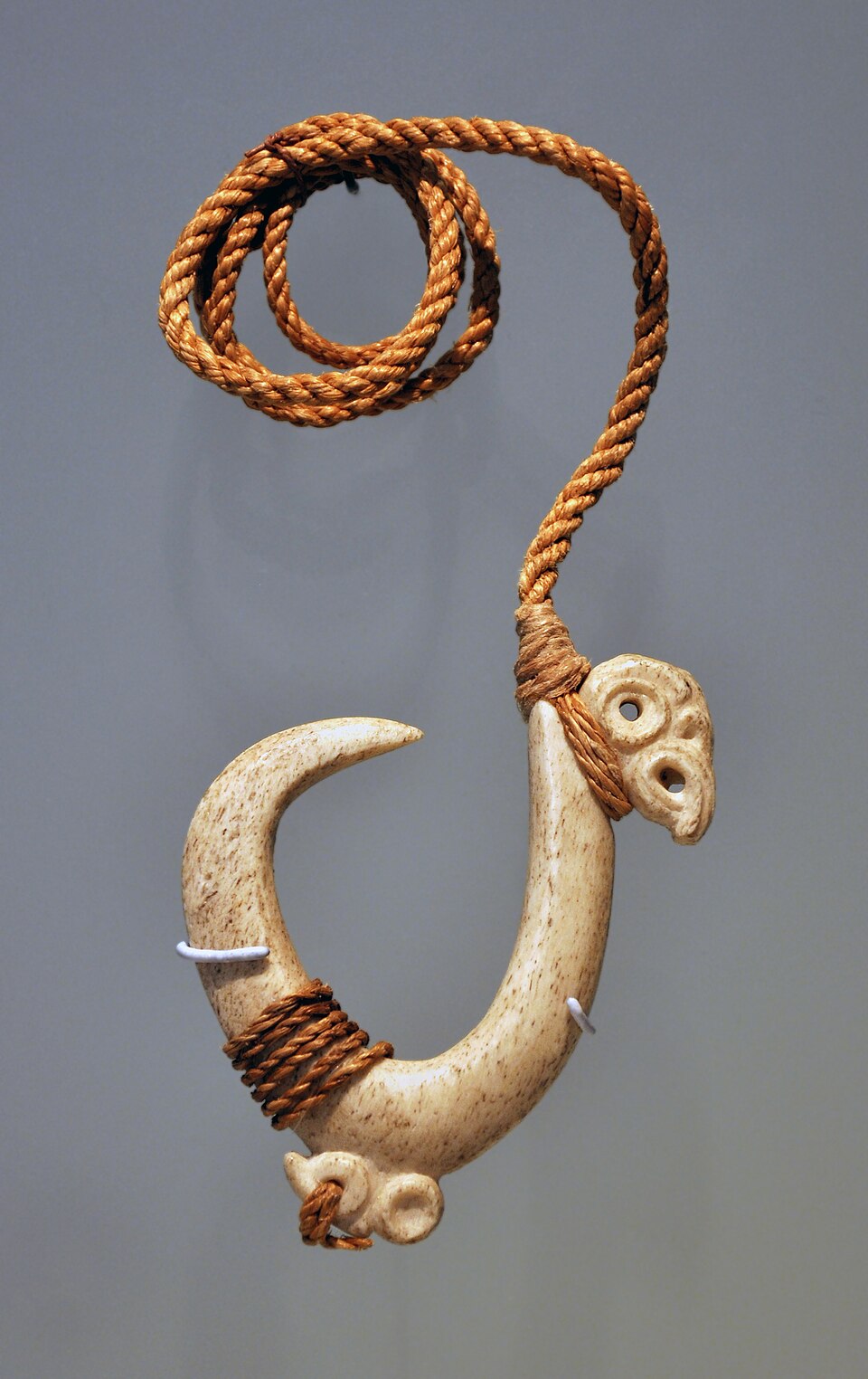 Photograph of a traditional Māori bone matau, or fishhook.